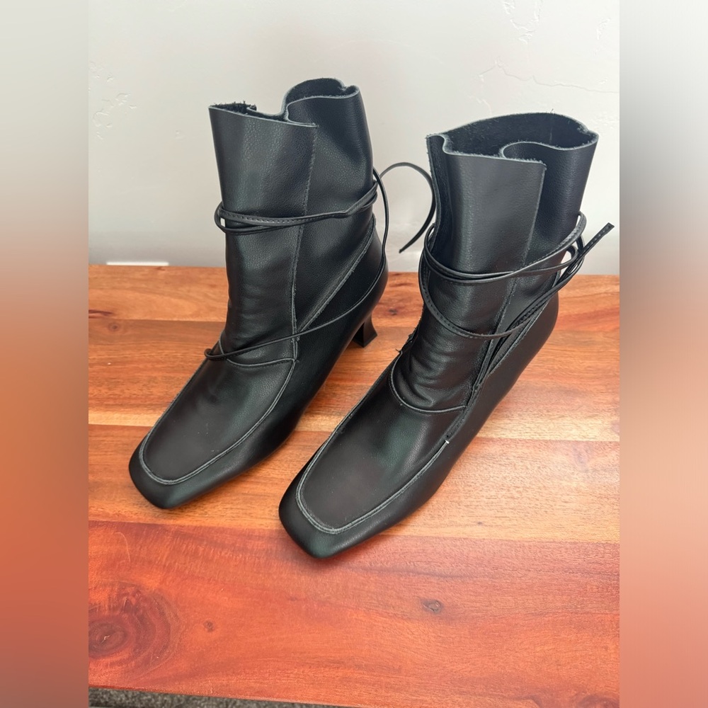 Brand new black leather boots.